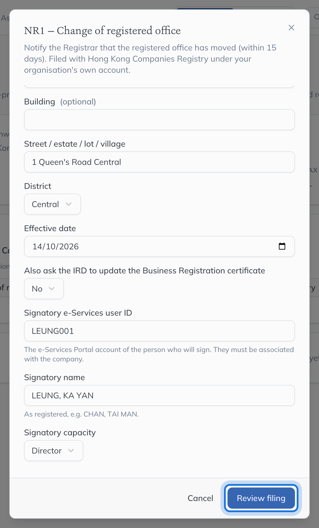 The NR1 form filled in with the new address and the signatory, with Review filing highlighted.